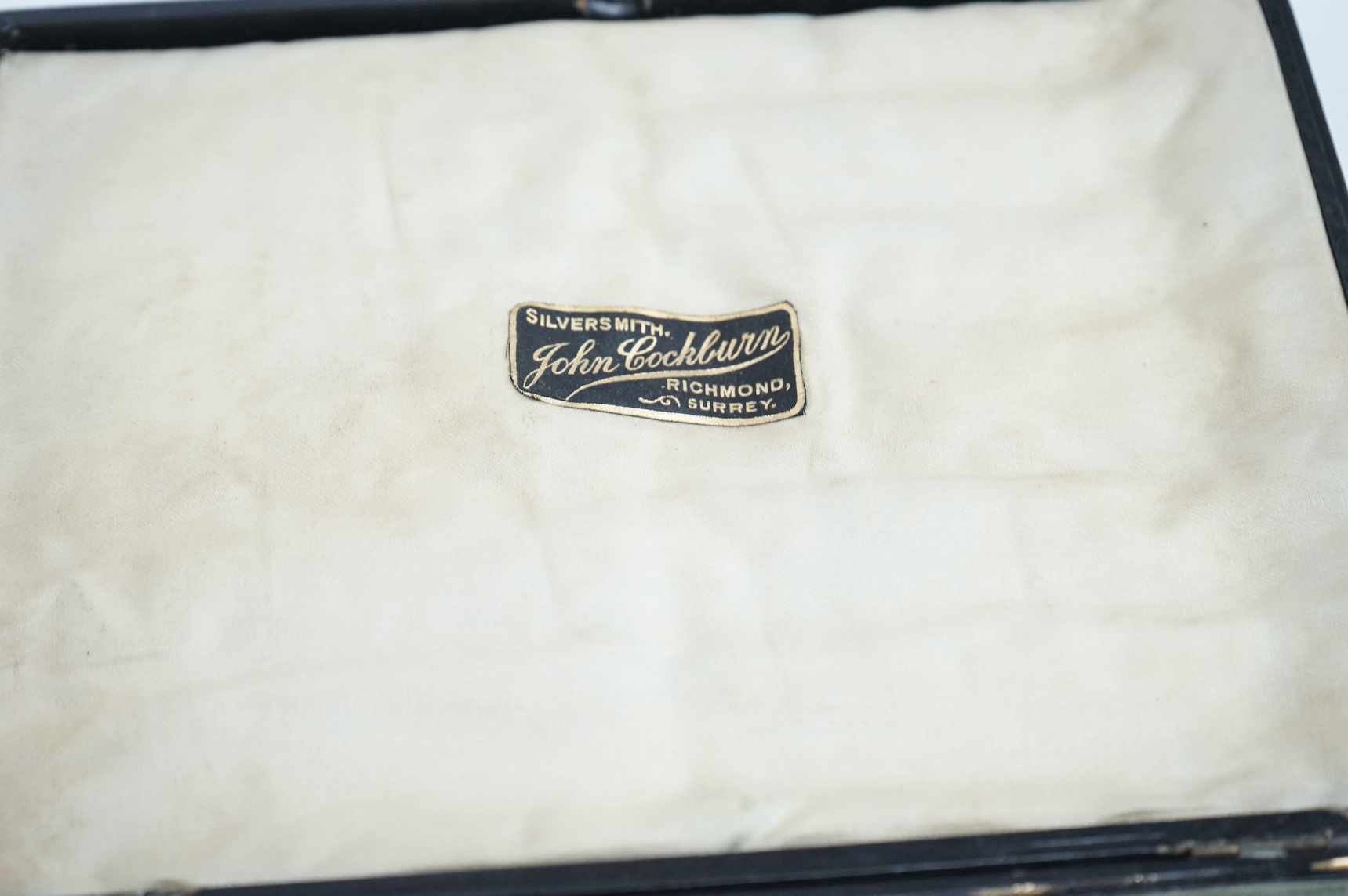 A George V silver mounted photograph frame, by A & J Zimmerman, Birmingham, 1923, 25.7cm, one other modern silver mounted photograph frame and a cased set of six silver handled tea knives. Condition - poor to fair